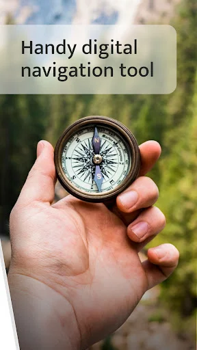 Hand holding physical compass in nature representing digital navigation tool for outdoor exploration and hiking