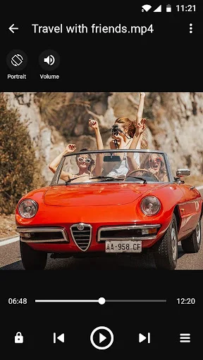 Built-in video player showing travel video with playback controls and portrait/volume adjustment options