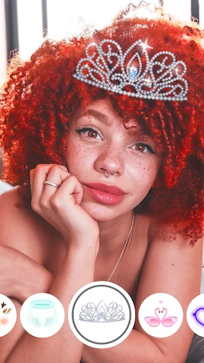 Face Live Camera with princess tiara filter and red hair effect, displaying filter options carousel